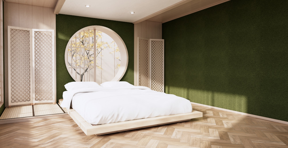 Sypialnia w kolorze butelkowej zieleni z niskim łóżkiem
